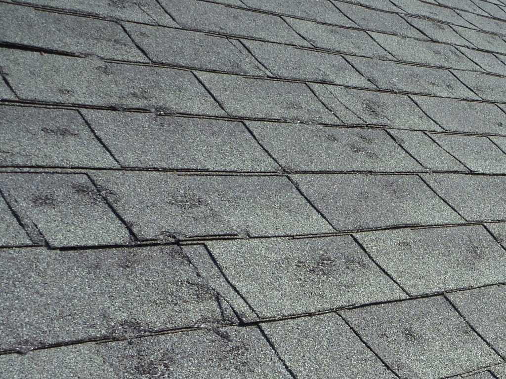 Midwest hail damage adjuster test square marked - Midwest roofing company