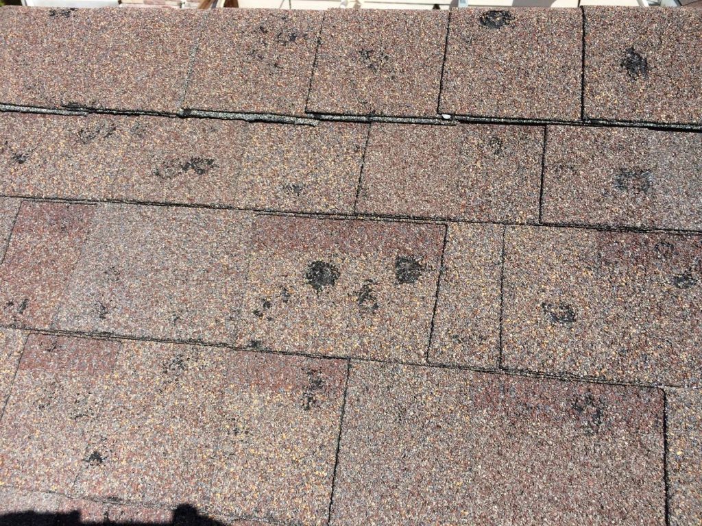 Midwest hail damage aged roof post storm - Cincinnati storm response