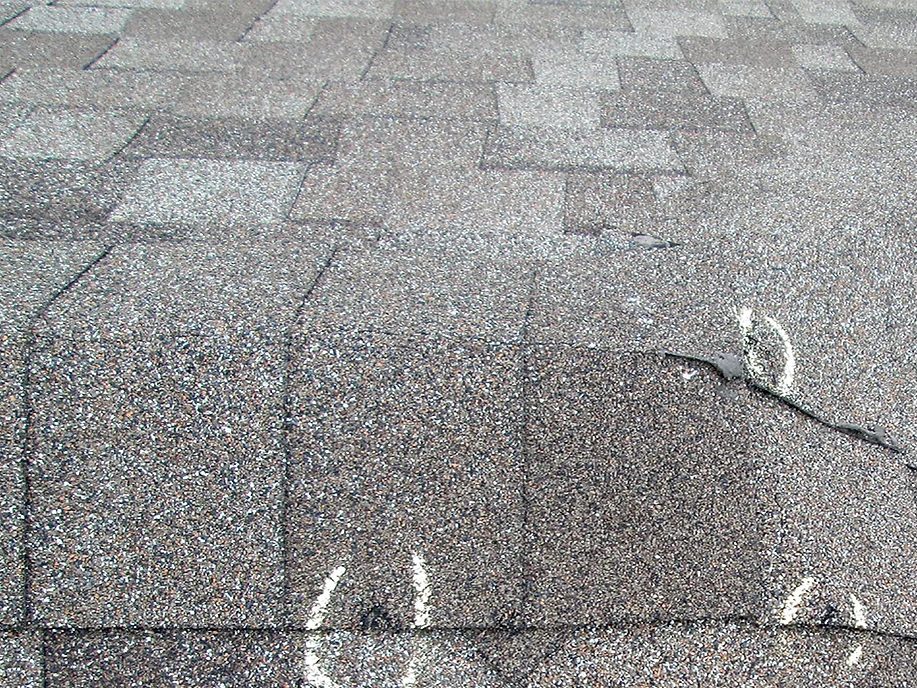 Midwest hail damage roofing contractor documenting commercial roof damage