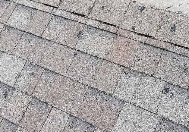 Midwest hail damage storm damaged ridge line - Springfield roof